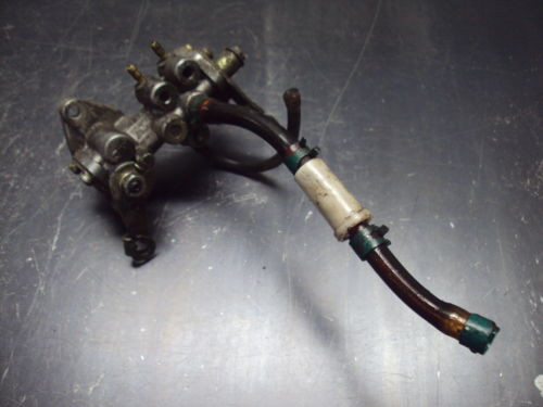 87 1987 INDY 650 POLARIS TRIPLE SNOWMOBILE INJECTION OIL PUMP INJECTOR